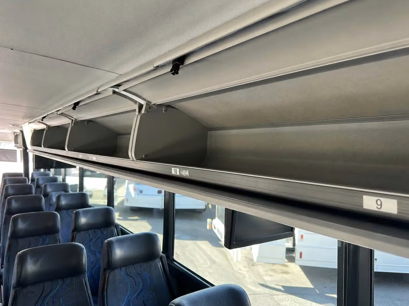 dalton 56 passenger charter bus overhead storage